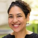 Teresa Gonzalez in a black shirt with short dark brown hair.